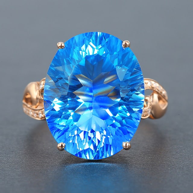 14k Gold 12.55 Ctw Natural Topaz & Diamond Ring: Ref:230976413 // gold content:14k gold // ring size:7. 25us // // main gemstone:topaz // shape:oval // carat weight:12. 49ct // color:blue // treatment:natural // // adjacent gemstone 2 : diamond