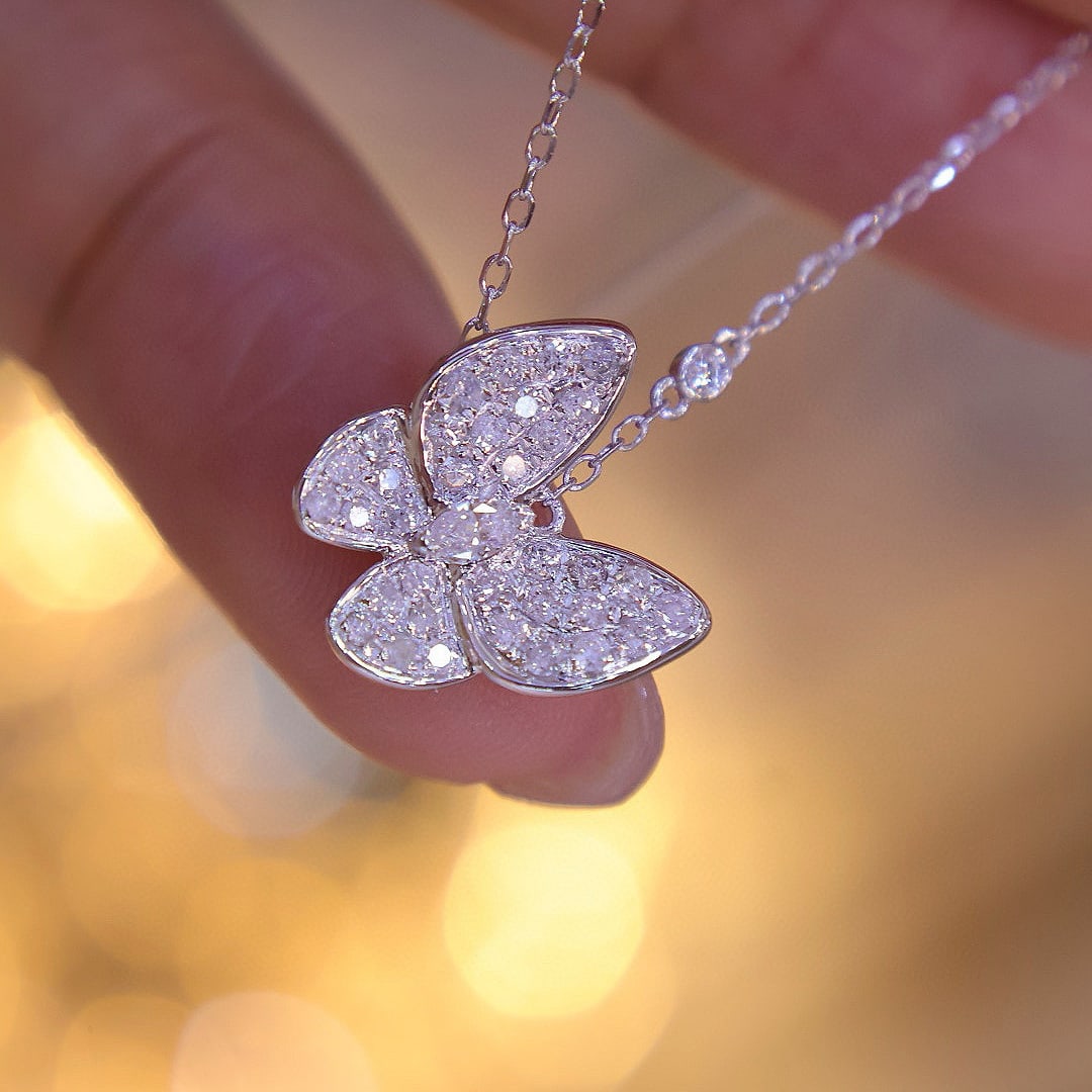 14k Gold 0.75 Ct Natural H Diamond & Butterfly Necklace: Ref:230976415 // gold content:14k gold // main gemstone:diamond // shape:multiply // carat weight:0. 75ct // clarity grade:vs-si // color:h // treatment:natural // High Estimate: 3100Low Estimate: