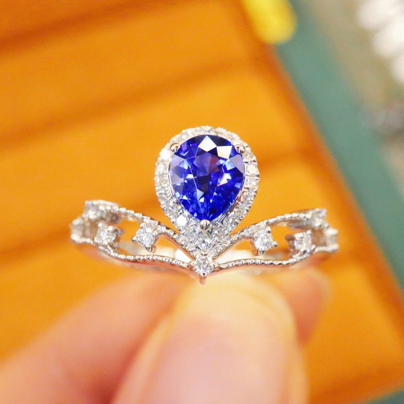 14k Gold 0.93 Ctw Natural Sapphire & Diamond Ring: Ref:230976423 // gold content:14k gold // ring size:7. 25us // // main gemstone:sapphire // shape:pear // carat weight:0. 72ct // color:royal blue // treatment:natural // // adjacent gemstone 2 :