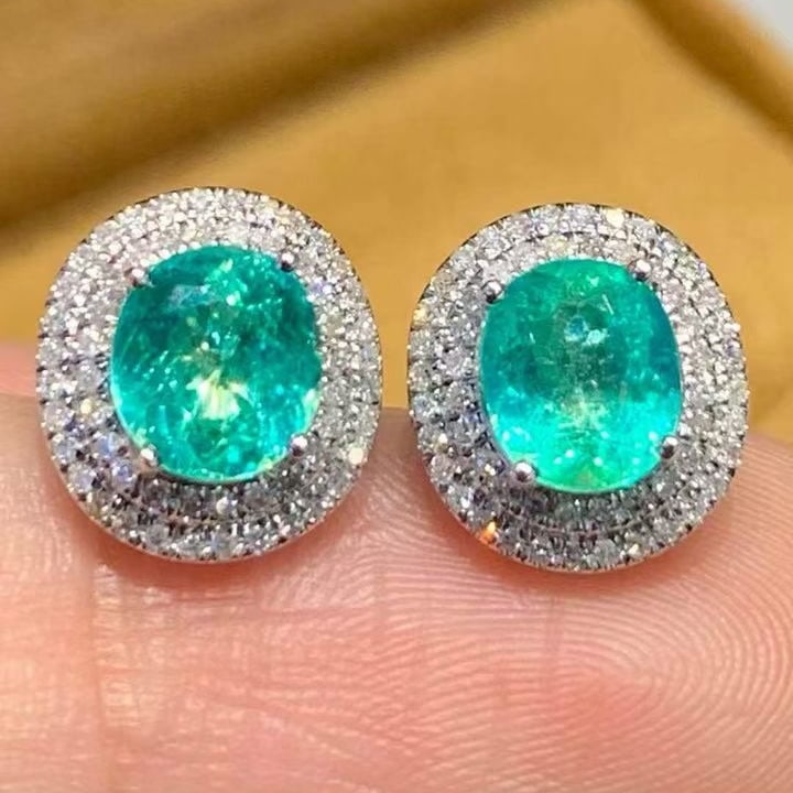 14k Gold 1.88 Ct Natural Paraiba Tourmaline & Diamond Earrings: Ref:231133019 // gold content:14k gold // main gemstone:paraiba tourmaline // shape:oval // carat weight:1. 88ct // color:bluish green // treatment:natural // // adjacent gemstone 2 : diamond //