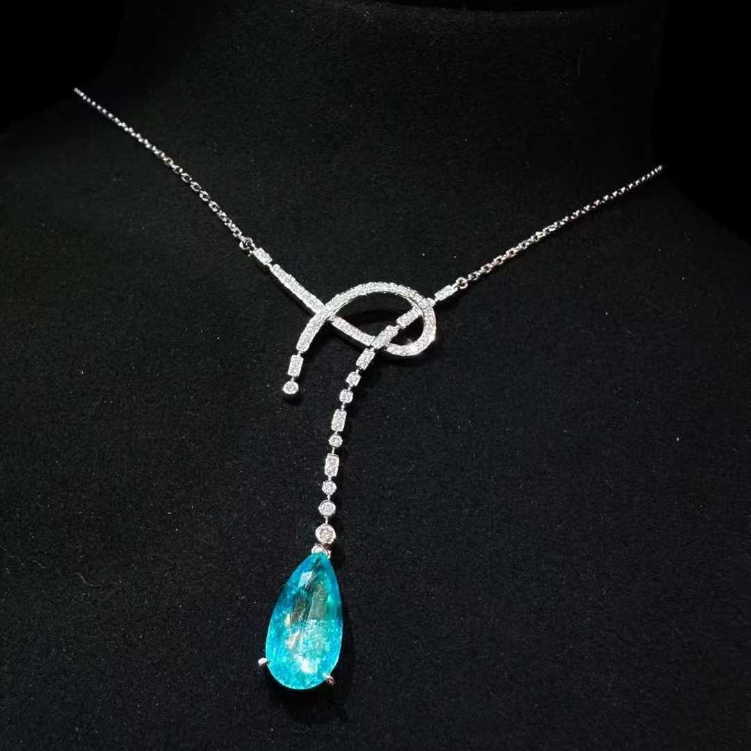 14k Gold 2.10 Ctw Natural Paraiba Tourmaline & Diamond Necklace: Ref:231133101 // gold content:14k gold // main gemstone:paraiba tourmaline // shape:pear // carat weight:1. 89ct // color:blue // treatment:natural // // adjacent gemstone 2 : diamond // shape:round /