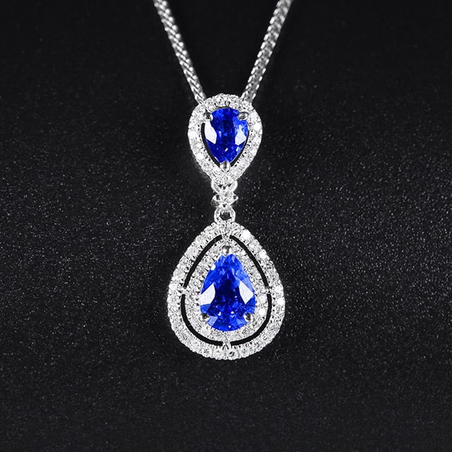 14k Gold 1.26 Ctw Natural Sapphire & Diamond Pendant( Without Chain ): Ref:231133124 // gold content:14k gold // main gemstone:sapphire // shape:pear // carat weight:1. 06ct // color:blue // treatment:natural // // adjacent gemstone 2 : diamond // number of stones:66