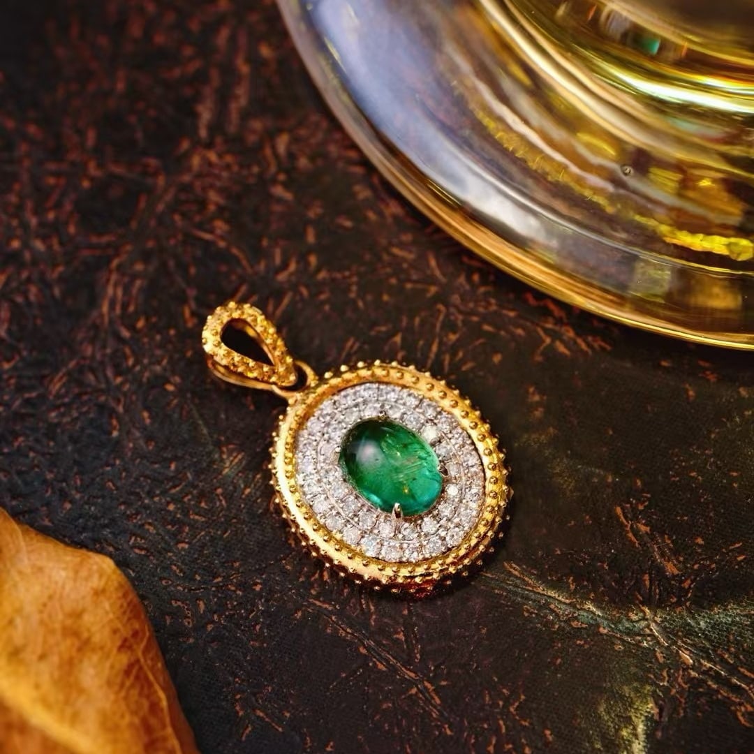 14k Gold 0.66 Ctw Natural Emerald & Diamond Pendant( Without Chain ): Ref:231133139 // gold content:14k gold // main gemstone:emerald // shape:oval // carat weight:0. 48ct // color:green // treatment:natural // // adjacent gemstone 2 : diamond // shape:round // carat