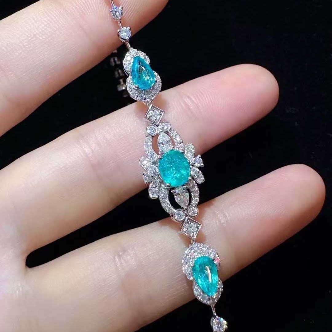 14k Gold 3.68 Ctw Natural Paraiba Tourmaline & Diamond Bracelet: Ref:231133193 // gold content:14k gold // main gemstone:paraiba tourmaline // shape:multiple // carat weight:1. 53ct // color:blue // treatment:natural // // adjacent gemstone 2 : diamond // shape:mul
