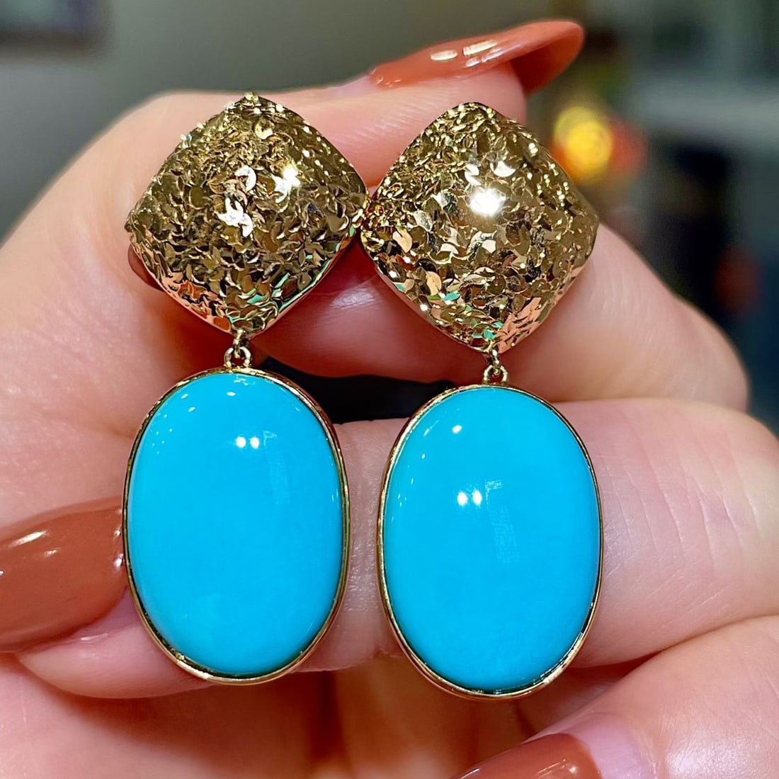 14k Gold 16.6 Ct Natural Blue Turquoise Earrings: Ref:231134117 // gold content:14k gold // main gemstone:blue turquoise // shape:oval // carat weight:16. 6ct // color:blue // treatment:natural // Condition: NewLow Estimate: 9700High Estimate: 15000