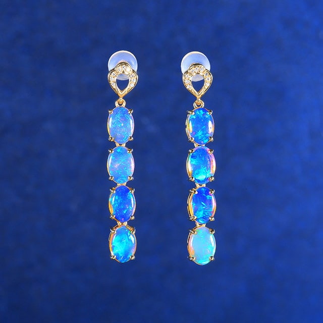 14k Gold 3.41 Ctw Natural Opal & Diamond Earrings: Ref:231134200 // gold content:14k gold // main gemstone:opal // shape:oval // carat weight:3. 36ct // color:color // treatment:natural // // adjacent gemstone 2 : diamond // number of stones:18 //