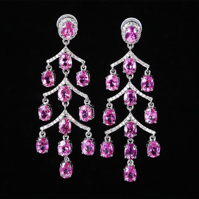 14k Gold 7.56 Ctw Natural Padparadscha Sapphire & Diamond Earrings: Ref:231134243 // gold content:14k gold // main gemstone:padparadscha sapphire // shape:oval // carat weight:7. 2ct // color:orangish pink // treatment:natural // // adjacent gemstone 2 : diamond //