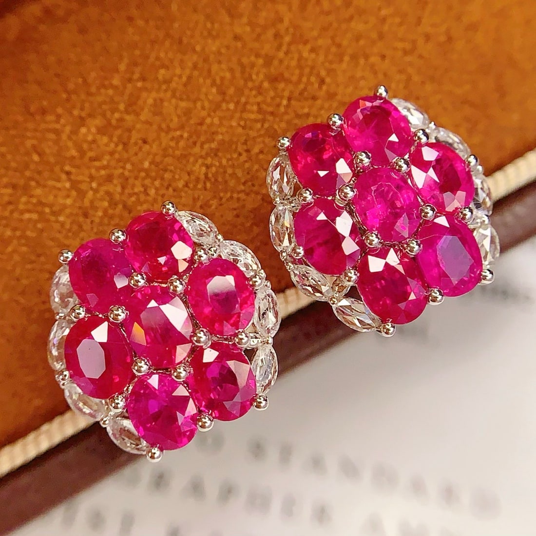 14k Gold 5.2 Ct Natural Ruby & Diamond Earrings: Ref:231134309 // gold content:14k gold // main gemstone:ruby // shape:oval // carat weight:5. 2ct // color:red // treatment:natural // // adjacent gemstone 2 : diamond // number of stones:16 //