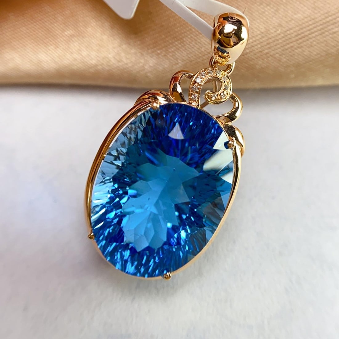 14k Gold 24.15 Ct Natural Topaz & Diamond Pendant( Without Chain ): Ref:231134408 // gold content:14k gold // main gemstone:topaz // shape:oval // carat weight:24. 15ct // color:blue // treatment:natural // // adjacent gemstone 2 : diamond // number of stones:10 //