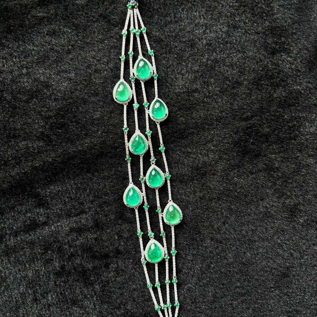 14k Gold 16.30 Ctw Natural Emerald & Diamond Bracelet: Ref:231134412 // gold content:14k gold // main gemstone:emerald // shape:pear // carat weight:13. 75ct // color:green // treatment:natural // // adjacent gemstone 2 : diamond // shape:round //