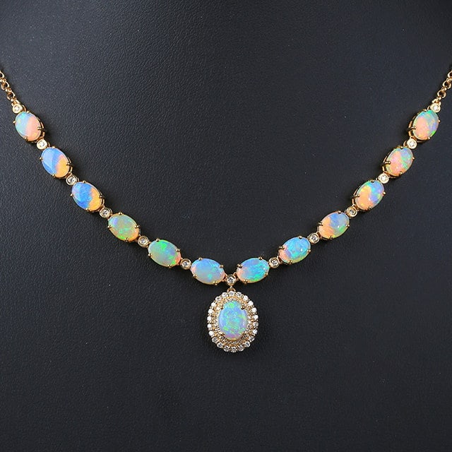 14k Gold 5.78 Ctw Natural Opal & Diamond Necklace: Ref:231129006 // gold content:14k gold // main gemstone:opal // shape:oval // carat weight:5. 35ct // color:color // treatment:natural // // adjacent gemstone 2 : diamond // number of stones:62 //