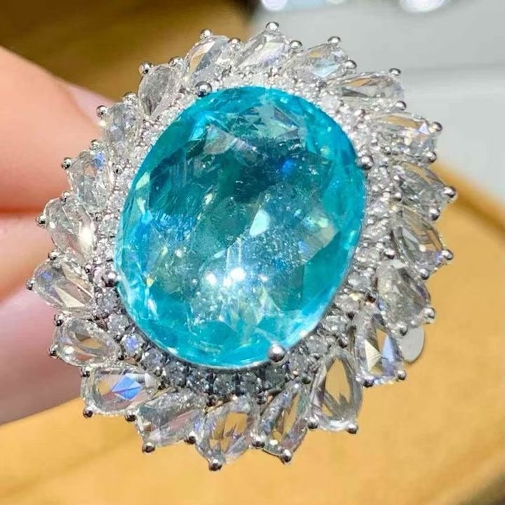 14k Gold 7.12 Ct Natural Paraiba Tourmaline & Diamond Ring: Ref:231129057 // gold content:14k gold // ring size:7. 25us // // main gemstone:paraiba tourmaline // shape:oval // carat weight:7. 12ct // color:blue // treatment:natural // // adjacent gemstone 2 :