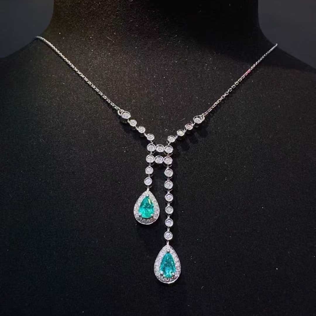 14k Gold 1.08 Ctw Natural Paraiba Tourmaline & Diamond Necklace: Ref:231129102 // gold content:14k gold // main gemstone:paraiba tourmaline // shape:pear // carat weight:0. 63ct // color:blue // treatment:natural // // adjacent gemstone 2 : diamond // shape:round /
