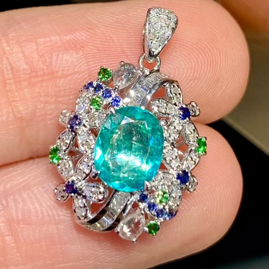 14k Gold 0.95 Ct Natural Paraiba Tourmaline & Diamond Pendant( Without Chain ): Ref:231129108 // gold content:14k gold // main gemstone:paraiba tourmaline // shape:oval // carat weight:0. 95ct // color:blue // treatment:natural // // adjacent gemstone 2 : diamond //