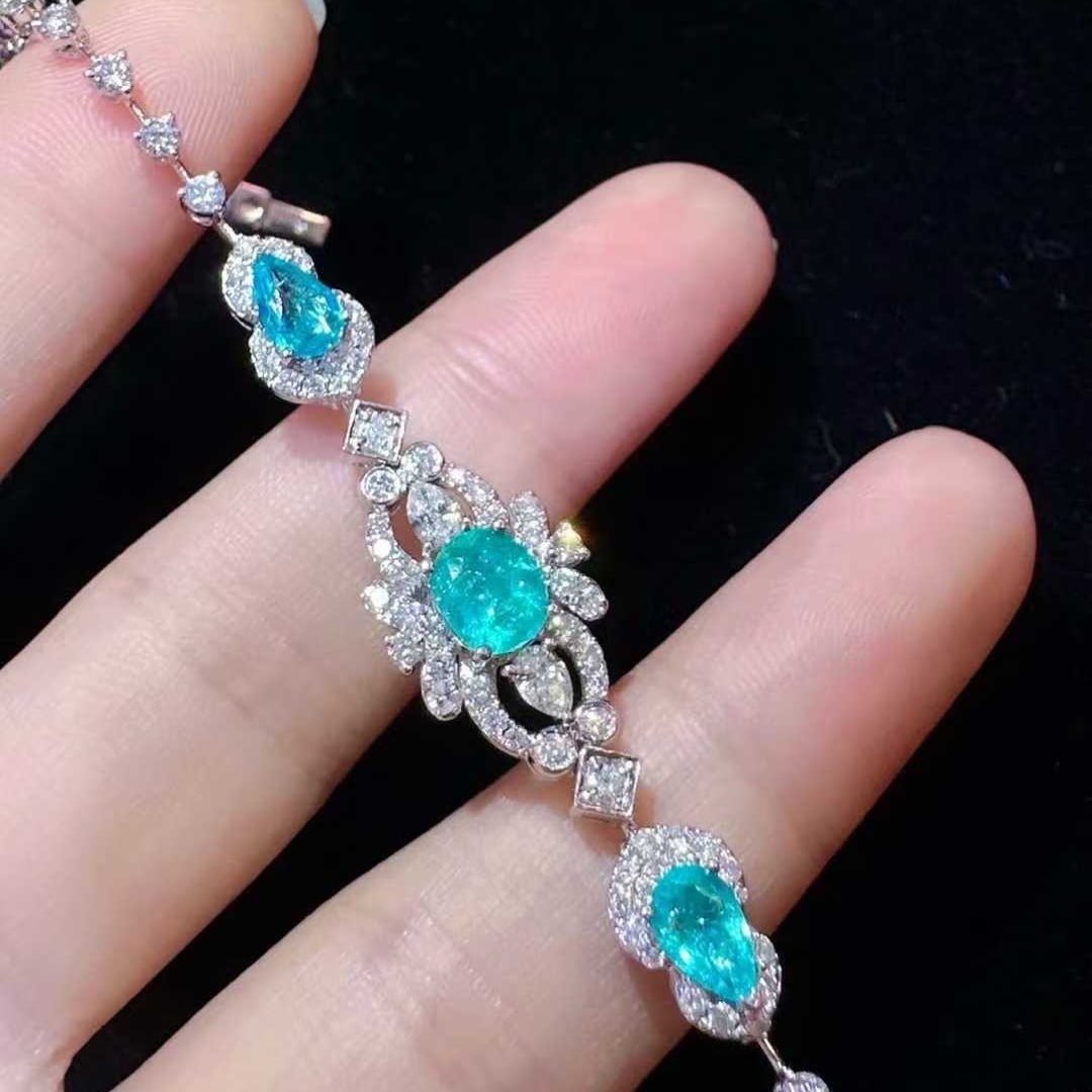 14k Gold 3.68 Ctw Natural Paraiba Tourmaline & Diamond Bracelet: Ref:231129149 // gold content:14k gold // main gemstone:paraiba tourmaline // shape:multiple // carat weight:1. 53ct // color:blue // treatment:natural // // adjacent gemstone 2 : diamond // shape:mul
