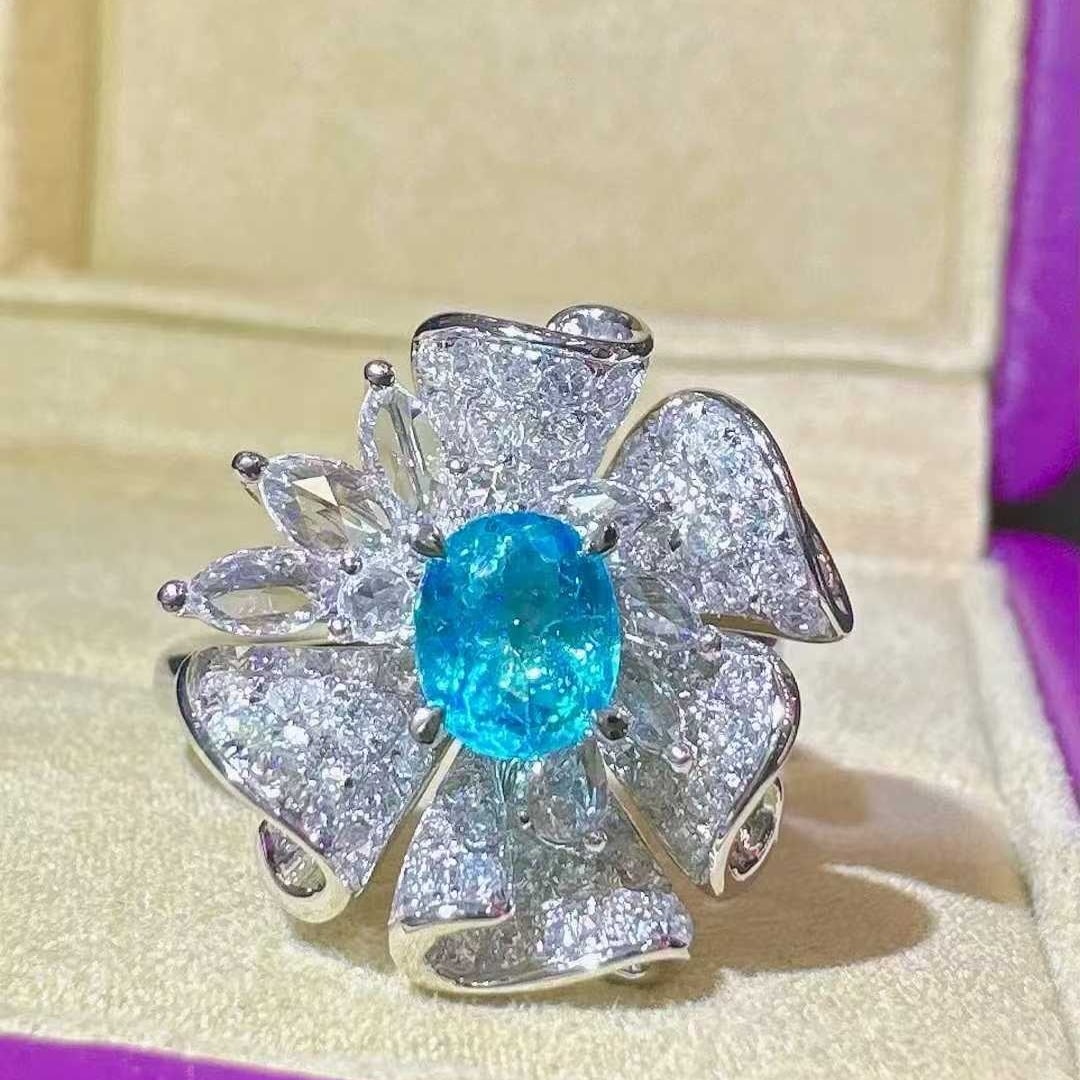 14k Gold 1.69 Ctw Natural Paraiba Tourmaline & Diamond Ring: Ref:231129239 // gold content:14k gold // ring size:7. 25us // // main gemstone:paraiba tourmaline // shape:oval // carat weight:0. 69ct // color:blue // treatment:natural // // adjacent gemstone 2 :