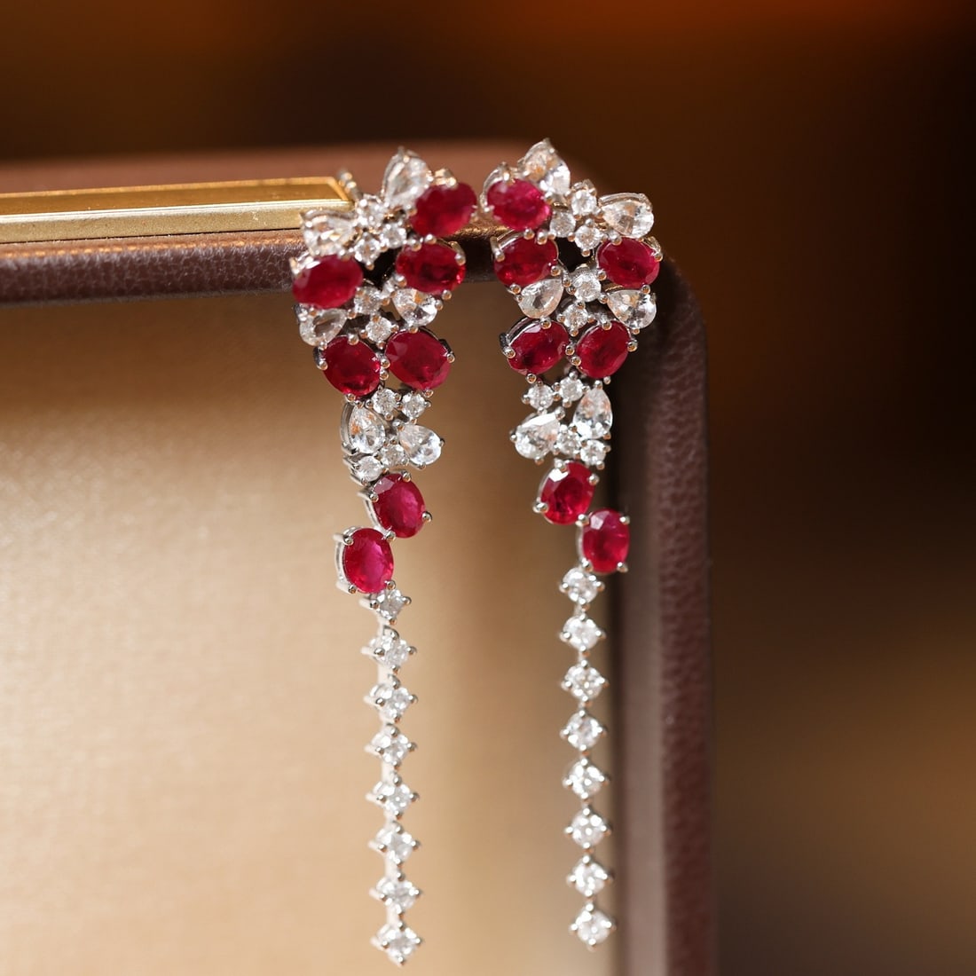 14k Gold 3.34 Ctw Natural Ruby & Sapphire Earrings: Ref:231130046 // gold content:14k gold // main gemstone:ruby // shape:oval // carat weight:2. 44ct // color:red // treatment:natural // // adjacent gemstone 2 : sapphire // shape:pear // carat