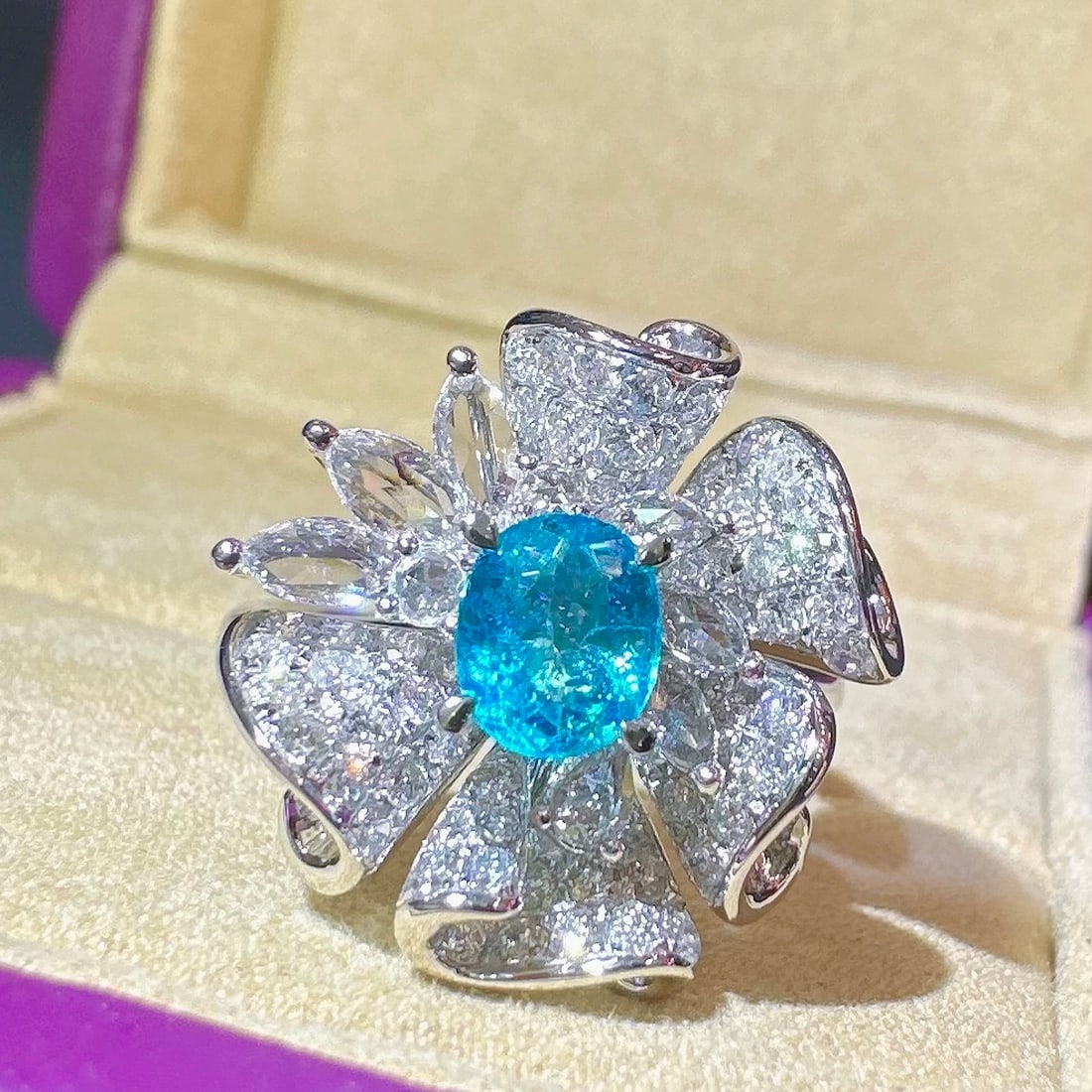 14k Gold 1.69 Ctw Natural Paraiba Tourmaline & Diamond Ring: Ref:231130120 // gold content:14k gold // ring size:7. 25us // // main gemstone:paraiba tourmaline // shape:oval // carat weight:0. 69ct // color:blue // treatment:natural // // adjacent gemstone 2 :