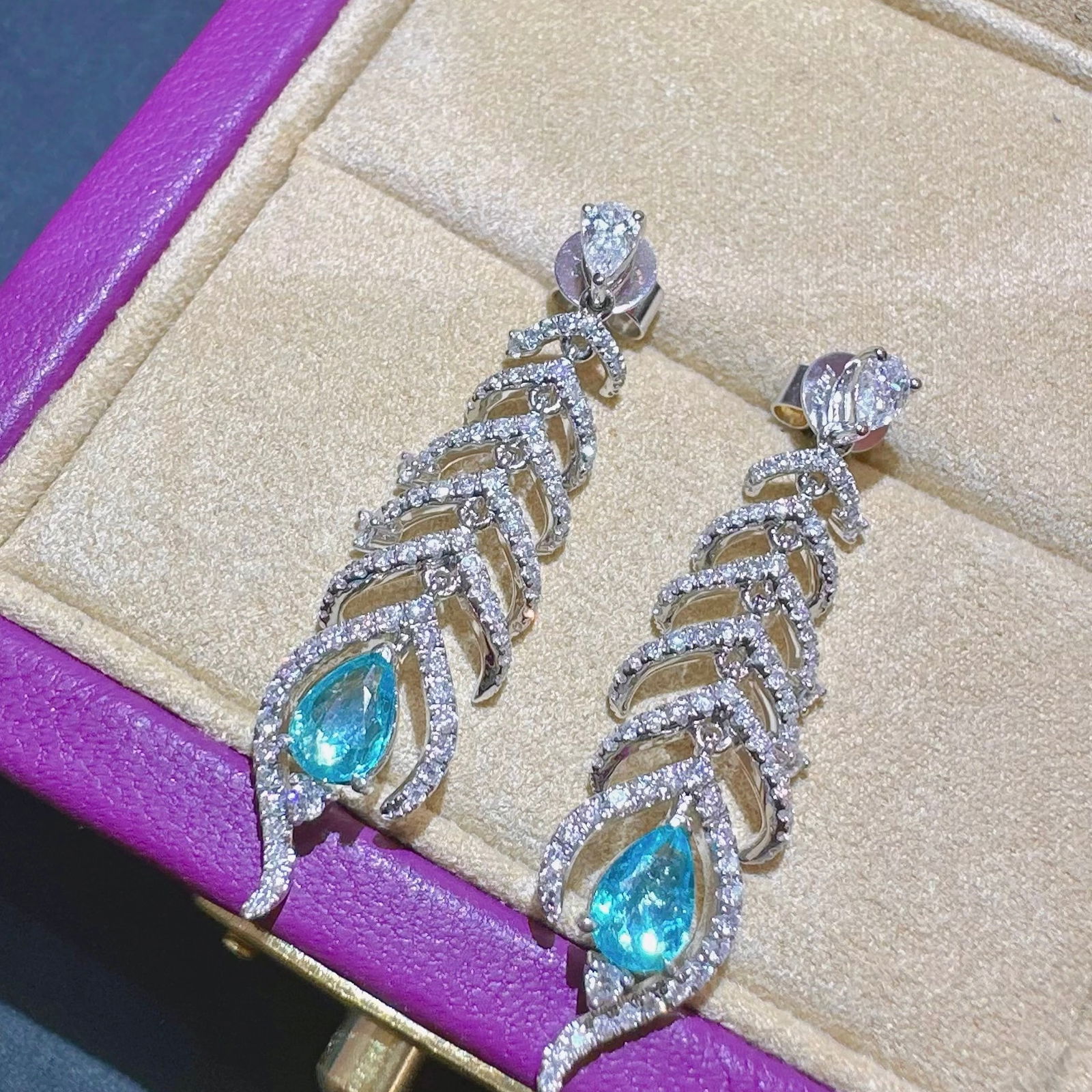 14k Gold 1.60 Ctw Natural Paraiba Tourmaline & Diamond Earrings: Ref:231130126 // gold content:14k gold // main gemstone:paraiba tourmaline // shape:pear // carat weight:0. 66ct // color:blue // treatment:natural // // adjacent gemstone 2 : diamond //
