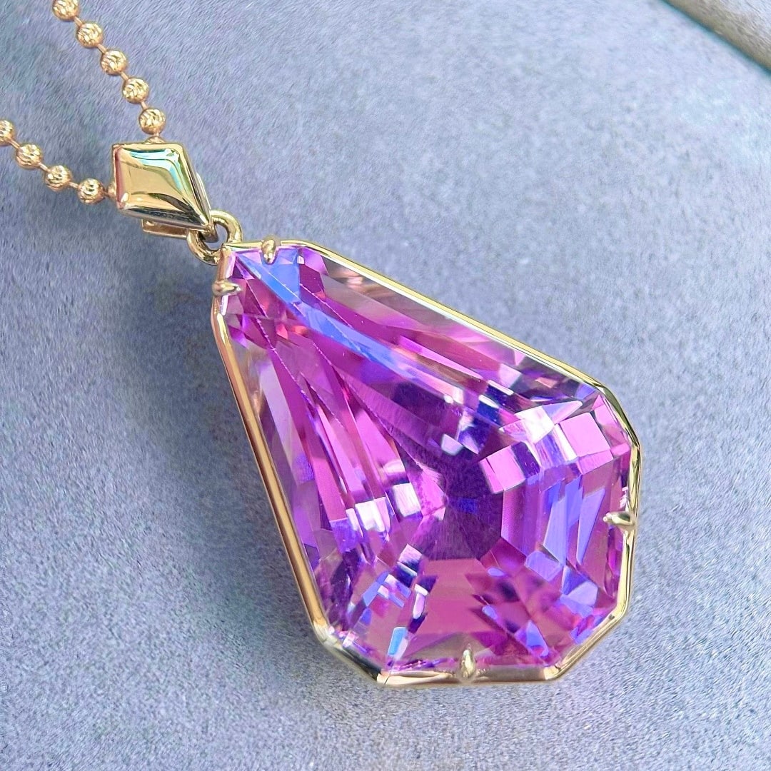 14k Gold 36.71 Ct Natural Kunzite Pendant( Without Chain ): Ref:231130131 // gold content:14k gold // main gemstone:kunzite // shape:other // carat weight:36. 71ct // color:purple // treatment:natural // Condition: NewLow Estimate: 5900.00High Estimate: