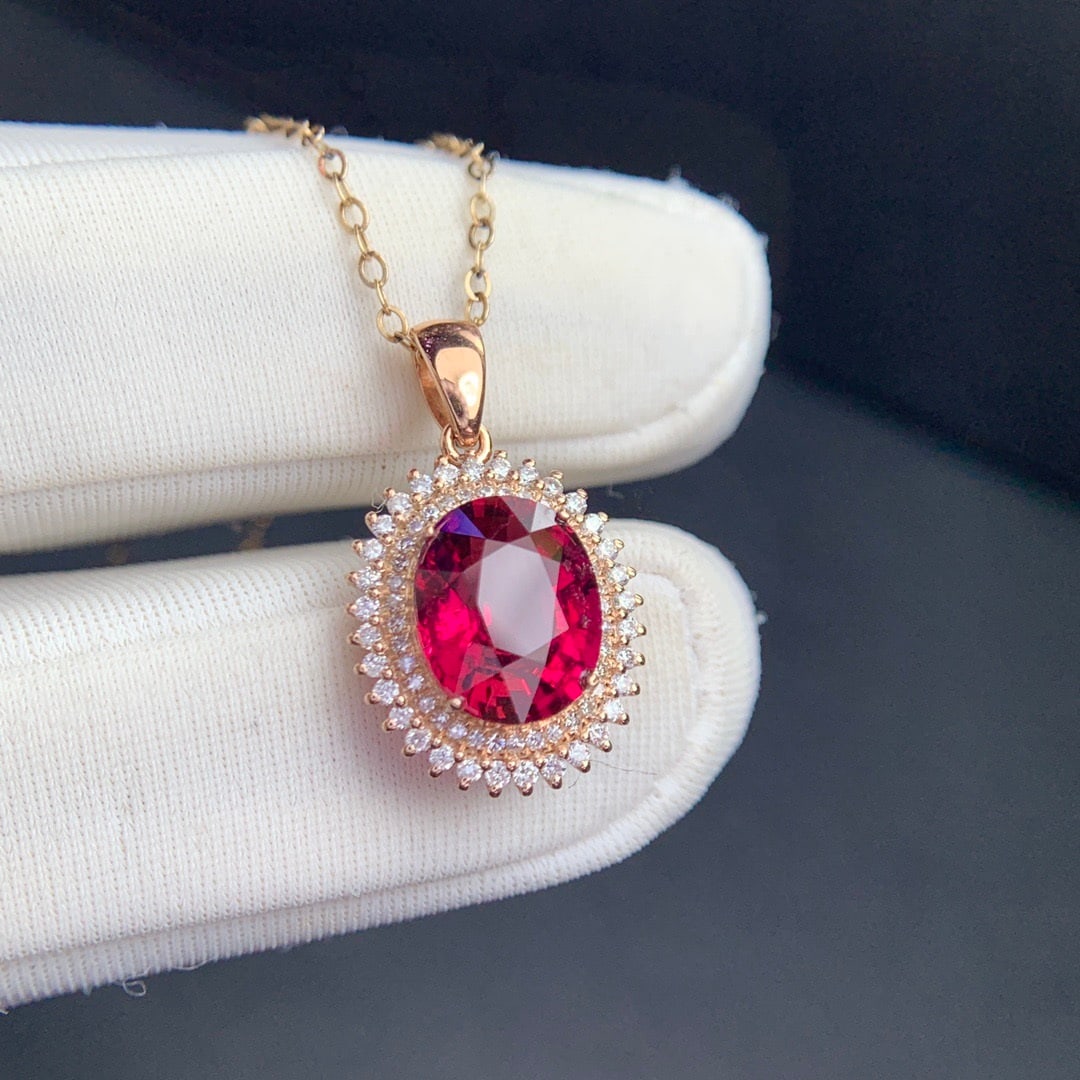 14k Gold 2.5 Ct Natural Tourmaline & Diamond Pendant( Without Chain ): Ref:231130157 // gold content:14k gold // main gemstone:tourmaline // shape:oval // carat weight:2. 5ct // color:red // treatment:natural // // adjacent gemstone 2 : diamond // shape:round // clarity