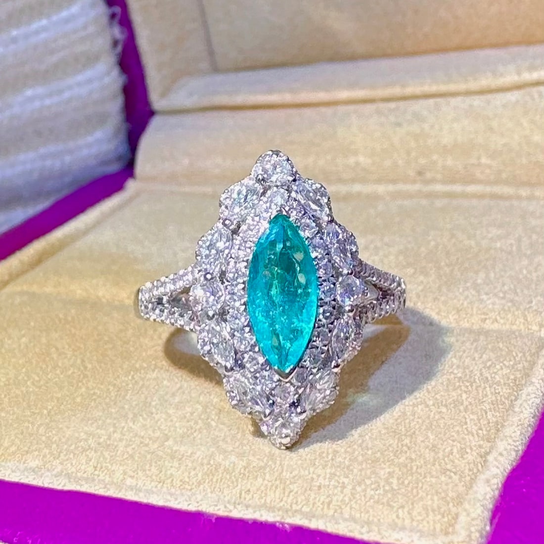 14k Gold 1.34 Ctw Natural Paraiba Tourmaline & Diamond Ring: Ref:231130175 // gold content:14k gold // ring size:7. 25us // // main gemstone:paraiba tourmaline // shape:marquise // carat weight:0. 54ct // color:blue // treatment:natural // // adjacent