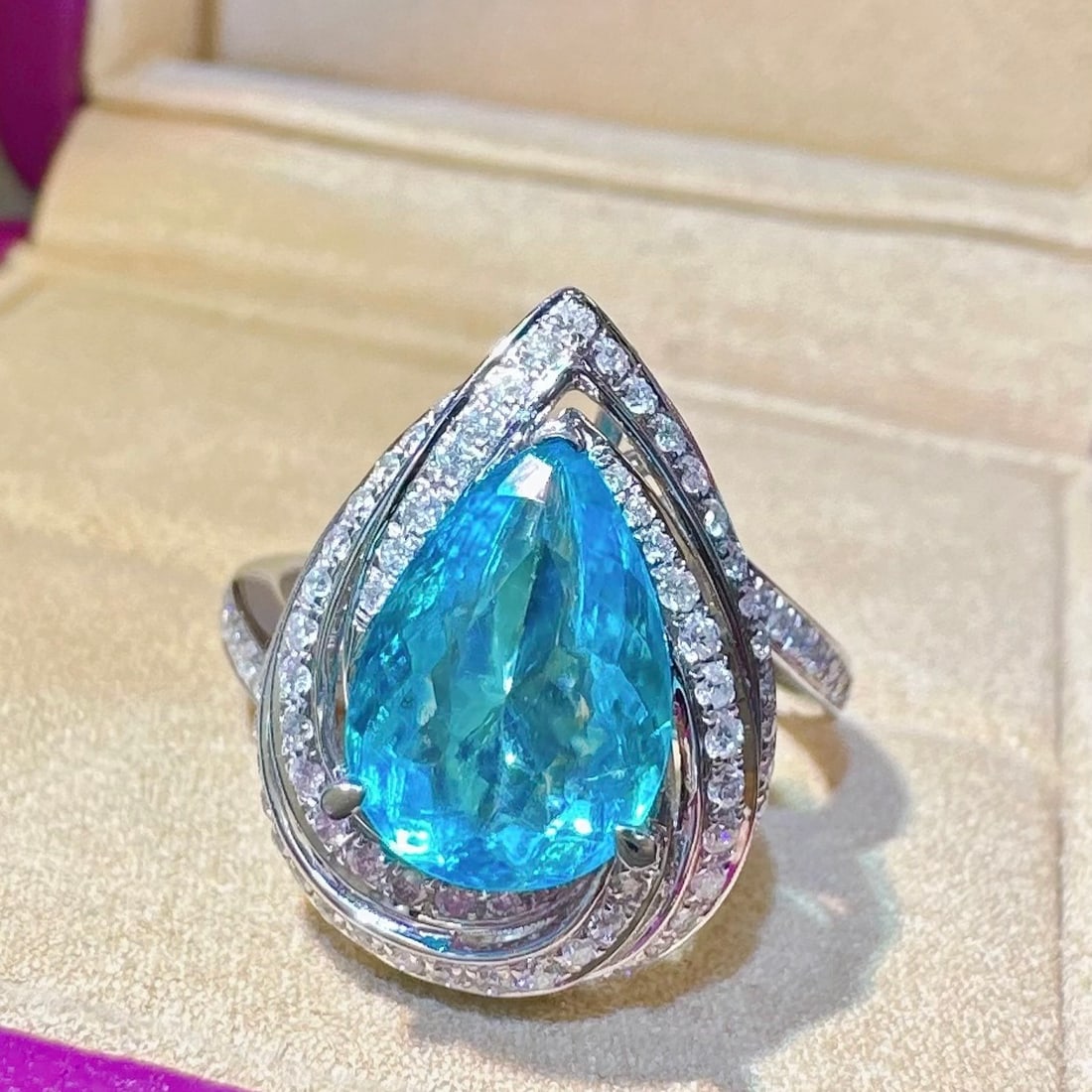 14k Gold 2.94 Ctw Natural Paraiba Tourmaline & Diamond Ring: Ref:231130177 // gold content:14k gold // ring size:7. 25us // // main gemstone:paraiba tourmaline // shape:pear // carat weight:2. 49ct // color:blue // treatment:natural // // adjacent gemstone