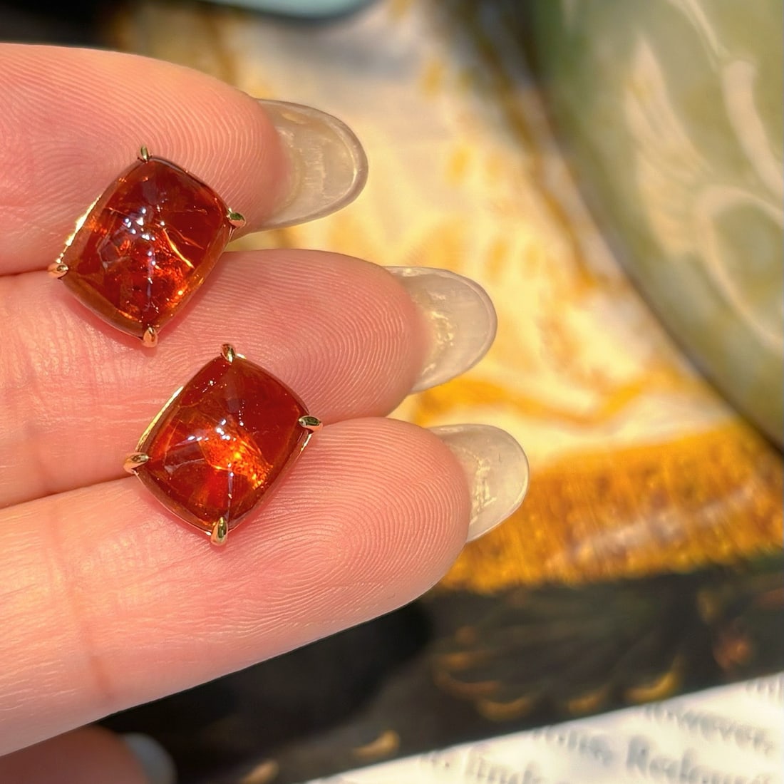 14k Gold 8.72 Ct Natural Spessartine Earrings: Ref:231130225 // gold content:14k gold // main gemstone:spessartine // shape:sugar-loaf // carat weight:8. 72ct // color:orange // treatment:natural // Condition: NewLow Estimate: 1300.00High