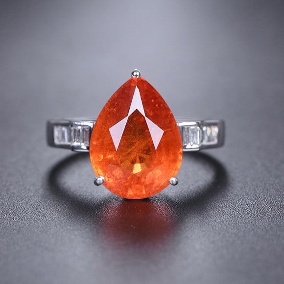 14k Gold 7.44 Ctw Natural Spessartine & Diamond Ring: Ref:231130245 // gold content:14k gold // ring size:7. 25us // // main gemstone:spessartine // shape:pear // carat weight:7. 2ct // color:orange // treatment:natural // // adjacent gemstone 2 : diamon