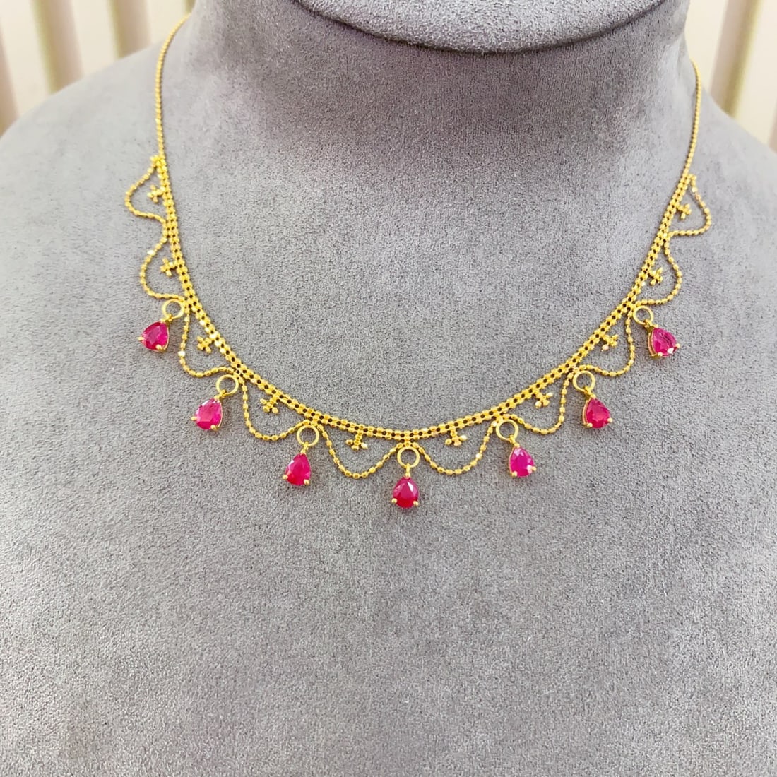14k Gold 2.80 Ct Natural Ruby Necklace: Ref:231130314 // gold content:14k gold // main gemstone:ruby // shape:pear // carat weight:2. 80ct // color:red // treatment:natural // Low Estimate: 5500Condition: NewHigh Estimate: 8300