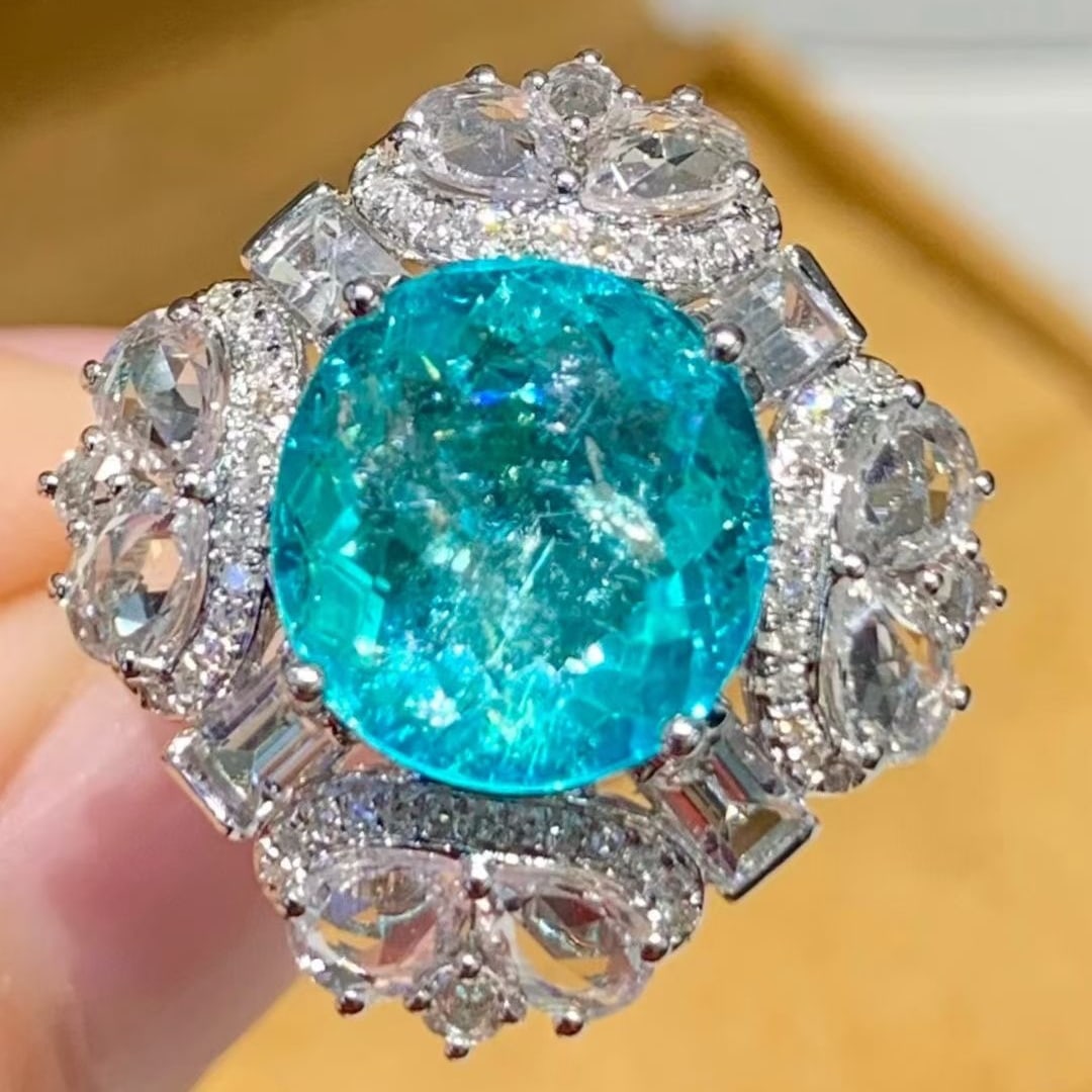 14k Gold 4.9 Ct Natural Paraiba Tourmaline & Diamond & Sapphire Ring: Ref:231127017 // gold content:14k gold // ring size:7. 25us // // main gemstone:paraiba tourmaline // shape:oval // carat weight:4. 9ct // color:blue // treatment:natural // // adjacent gemstone 2