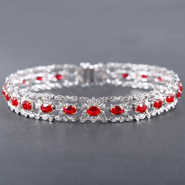 14k Gold 6.59 Ctw Vivid Red Natural Ruby & Diamond Bracelet: Ref:231127034 // gold content:14k gold // main gemstone:ruby // shape:oval // carat weight:5. 2ct // color:vivid red // treatment:natural // // adjacent gemstone 2 : diamond // number of stones:208