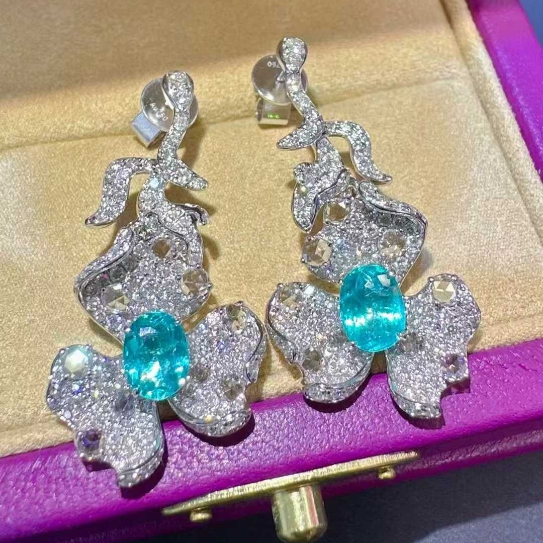 14k Gold 3.78 Ctw Natural Paraiba Tourmaline & Diamond Earrings: Ref:231127100 // gold content:14k gold // main gemstone:paraiba tourmaline // shape:oval // carat weight:1. 65ct // color:blue // treatment:natural // // adjacent gemstone 2 : diamond //