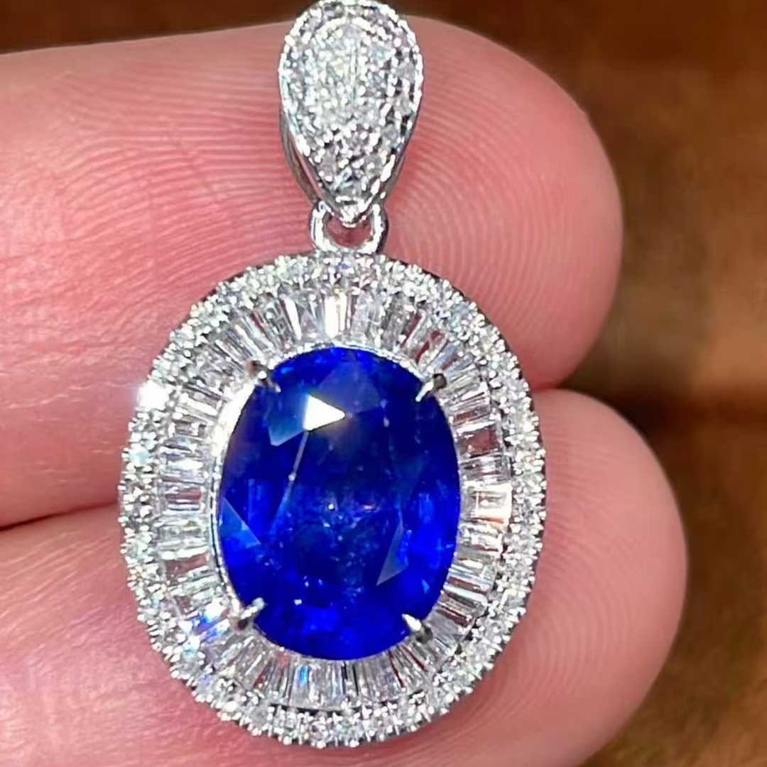 14k Gold 3.4 Ctw Natural Sapphire & Diamond Pendant( Without Chain ): Ref:231127125 // gold content:14k gold // main gemstone:sapphire // shape:oval // carat weight:3ct // color:blue // treatment:natural // // adjacent gemstone 2 : diamond // shape:multiple // carat wei