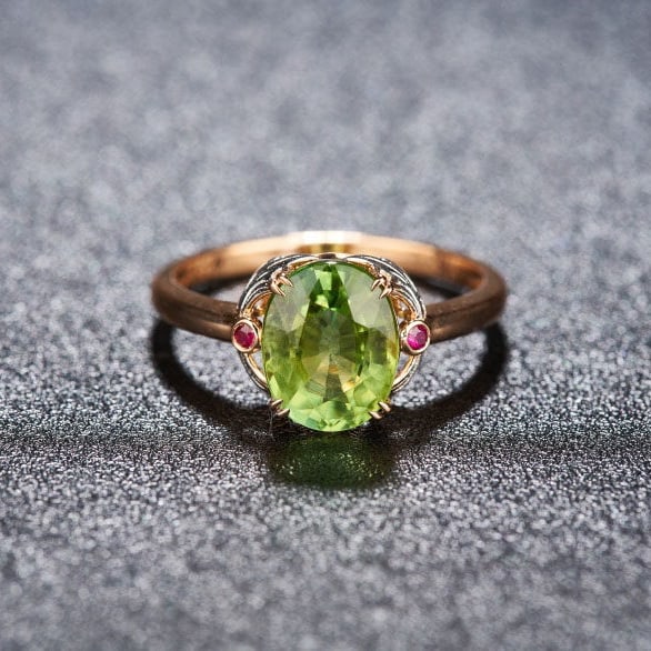 14k Gold 2.25 Ct Natural Tourmaline & Ruby Ring: Ref:231127197 // gold content:14k gold // ring size:7. 25us // // main gemstone:tourmaline // shape:oval // carat weight:2. 25ct // color:green // treatment:natural // // adjacent gemstone 2 :
