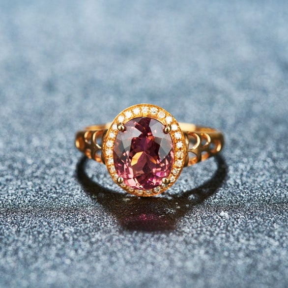 14k Gold 2.5 Ct Natural Tourmaline & Diamond Ring: Ref:231128013 // gold content:14k gold // ring size:7. 25us // // main gemstone:tourmaline // shape:oval // carat weight:2. 5ct // color:red // treatment:natural // // adjacent gemstone 2 :