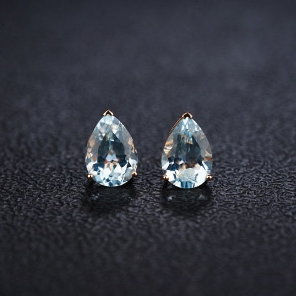 14k Gold 3.6 Ct Natural Aquamarine Earrings: Ref:231128054 // gold content:14k gold // main gemstone:aquamarine // shape:pear // carat weight:3. 6ct // color:blue // treatment:natural // Low Estimate: 1500 Condition: New High Estimate: 2300