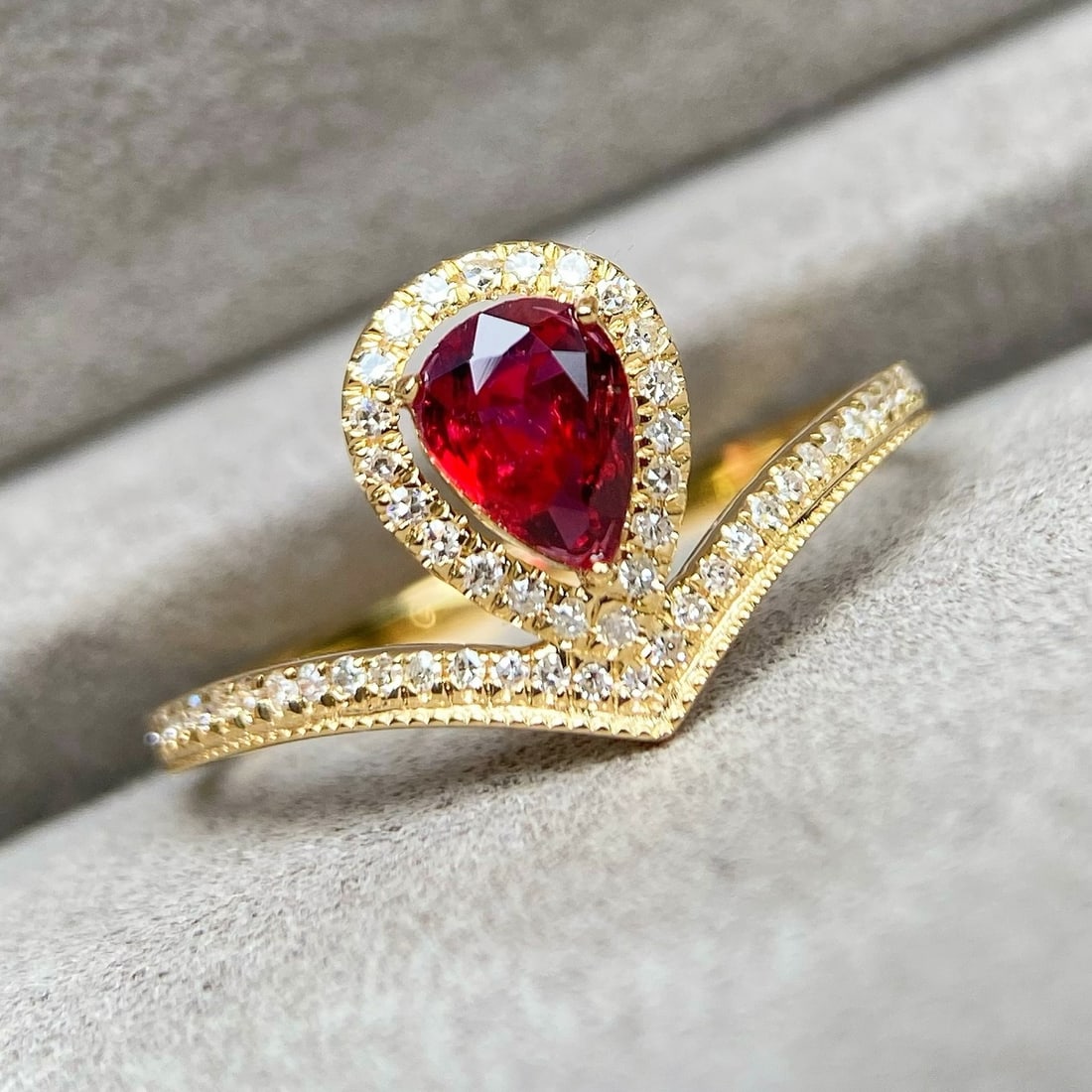 14k Gold 0.76 Ctw Natural Ruby & Diamond Ring: Ref:231128110 // gold content:14k gold // ring size:7. 25us // // main gemstone:ruby // shape:pear // carat weight:0. 52ct // color:pigeonblood red // treatment:natural // // adjacent gemstone 2 :