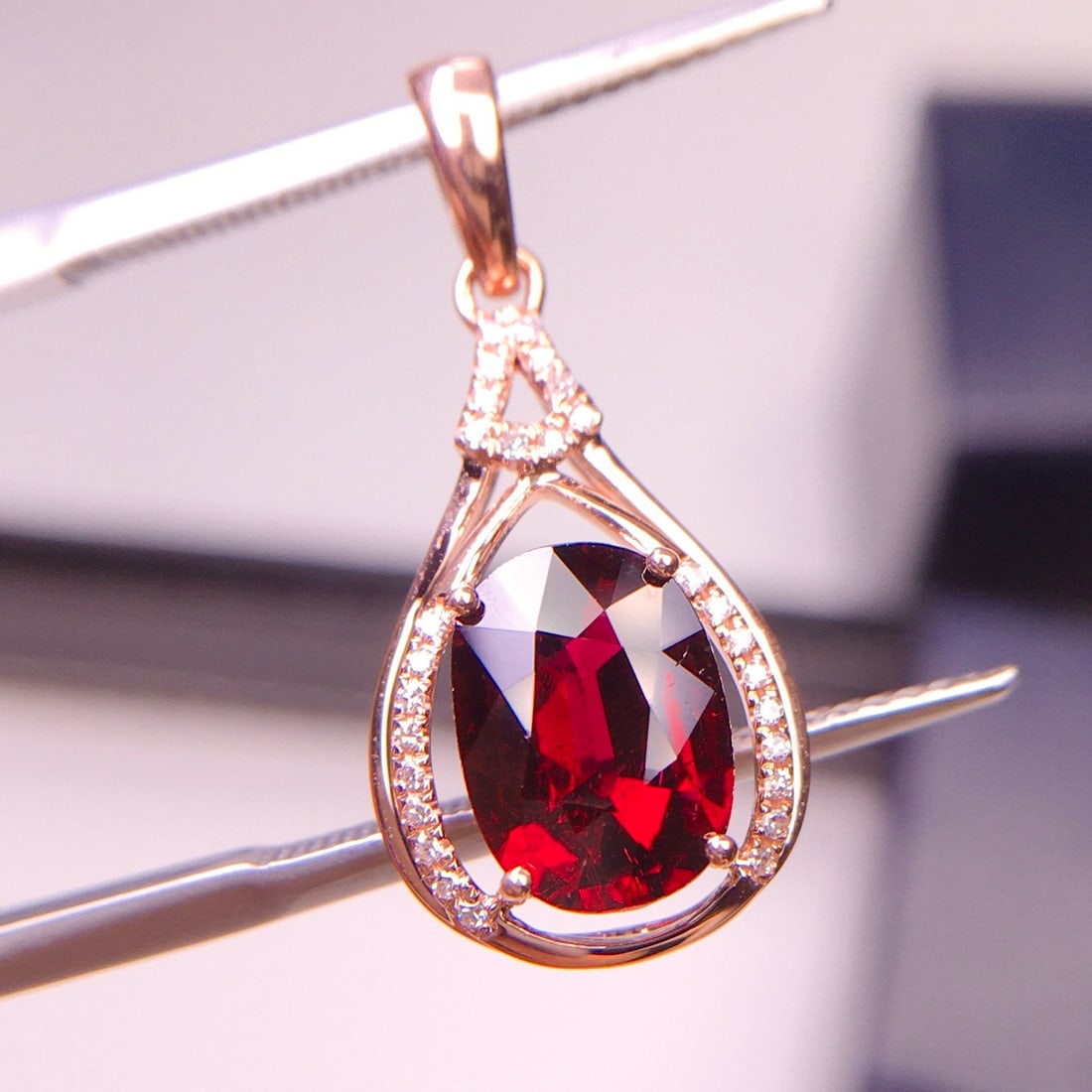 14k Gold 1.9 Ct Natural Tourmaline & Diamond Pendant( Without Chain ): Ref:231128149 // gold content:14k gold // main gemstone:tourmaline // shape:oval // carat weight:1. 9ct // color:red // treatment:natural // // adjacent gemstone 2 : diamond // shape:round //