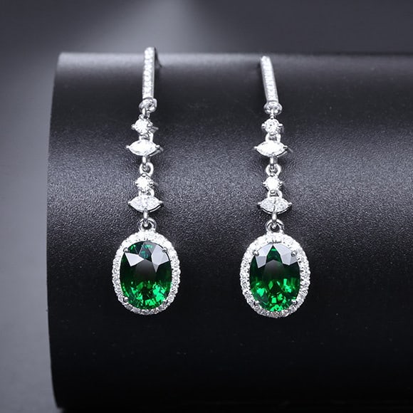 14k Gold 3.17 Ctw Vivid Green Natural Tsavorite & Diamond Earrings: Ref:231128252 // gold content:14k gold // main gemstone:tsavorite // shape:oval // carat weight:2. 68ct // color:vivid green // treatment:natural // // adjacent gemstone 2 : diamond //