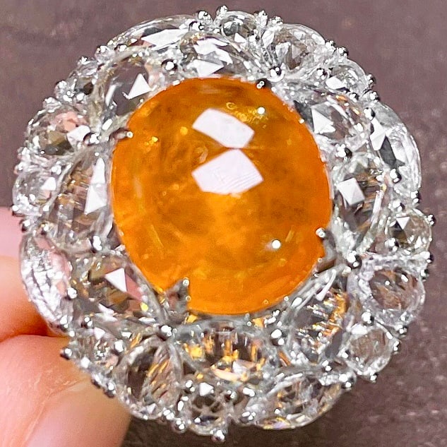 14k Gold 9.00 Ctw Natural Spessartine & Sapphire Ring: Ref:231128391 // gold content:14k gold // ring size:7. 25us // // main gemstone:spessartine // shape:oval // carat weight:5. 86ct // color:orange // treatment:natural // // adjacent gemstone 2 :