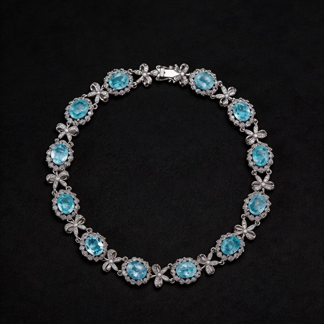 14k Gold 6.2 Ct Natural Paraiba Tourmaline & Diamond Bracelet: Ref:230794047 // gold content:14k gold // main gemstone:paraiba tourmaline // shape:oval // carat weight:6. 2ct // color:blue // treatment:natural // // adjacent gemstone 2 : diamond // shape:round