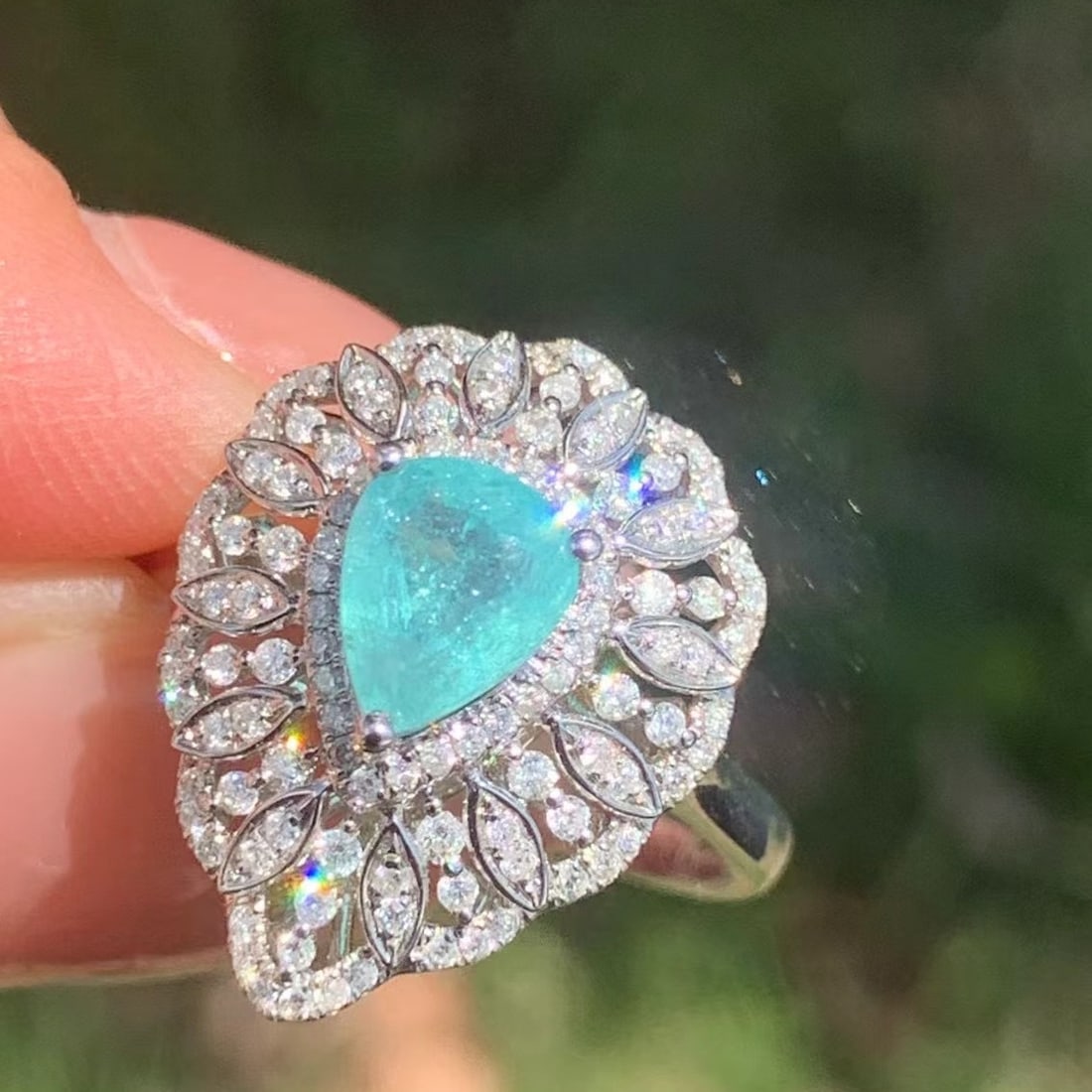 14k Gold 1.2 Ct Natural Paraiba Tourmaline & Diamond Ring: Ref:230941111 // gold content:14k gold // ring size:7. 25us // // main gemstone:paraiba tourmaline // shape:pear // carat weight:1. 2ct // color:blue // treatment:natural // // adjacent gemstone 2 : d