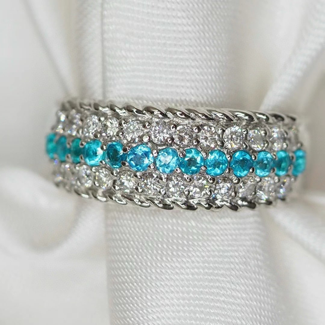 14k Gold 0.74 Ctw Natural Paraiba Tourmaline & Diamond Ring: Ref:230942016 // gold content:14k gold // ring size:7. 25us // // main gemstone:paraiba tourmaline // shape:round // carat weight:0. 31ct // color:blue // treatment:natural // cut grade:g // // adjace