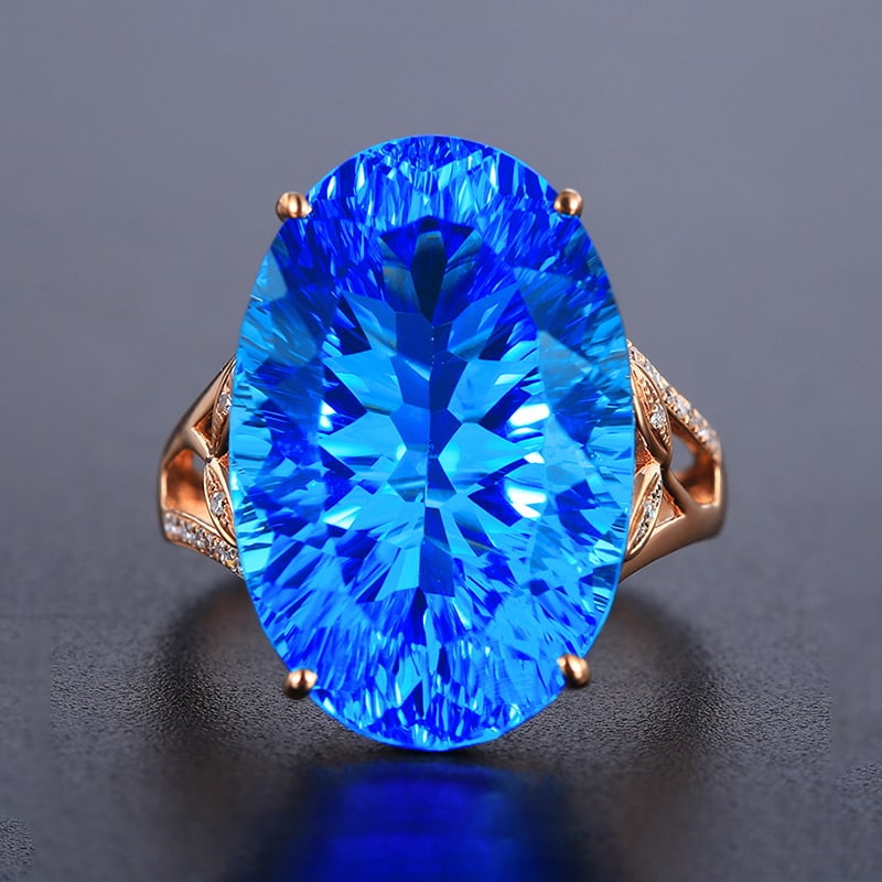 14k Gold 20.19 Ctw Natural Topaz & Diamond Ring: Ref:230939018 // gold content:14k gold // ring size:7. 25us // // main gemstone:topaz // shape:oval // carat weight:20. 11ct // color:blue // treatment:natural // // adjacent gemstone 2 : diamond // n