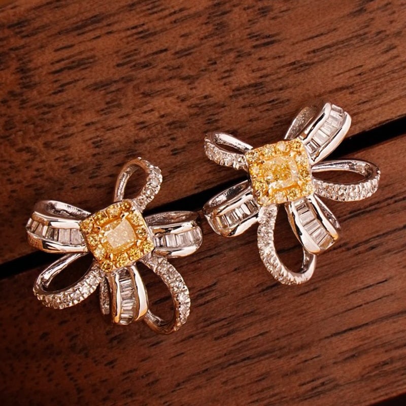 14k Gold 0.7 Ct Natural Color Diamond Earrings: Ref:230939173 // gold content:14k gold // main gemstone:diamond // shape:multiply // carat weight:0. 7ct // clarity grade:vs-si // color:color // treatment:natural // Condition: NewLow Estimate: