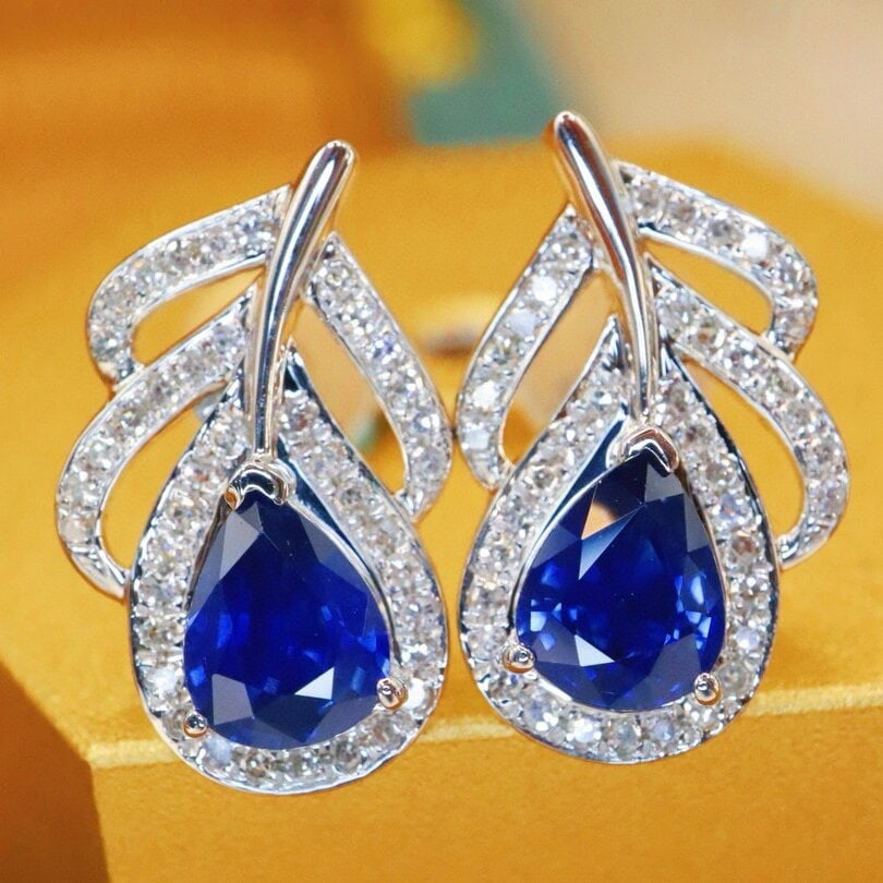 14k Gold 1.52 Ctw Natural Sapphire & Diamond Earrings: Ref:230940053 // gold content:14k gold // main gemstone:sapphire // shape:pear // carat weight:1. 28ct // color:royal blue // treatment:natural // // adjacent gemstone 2 : diamond // number of