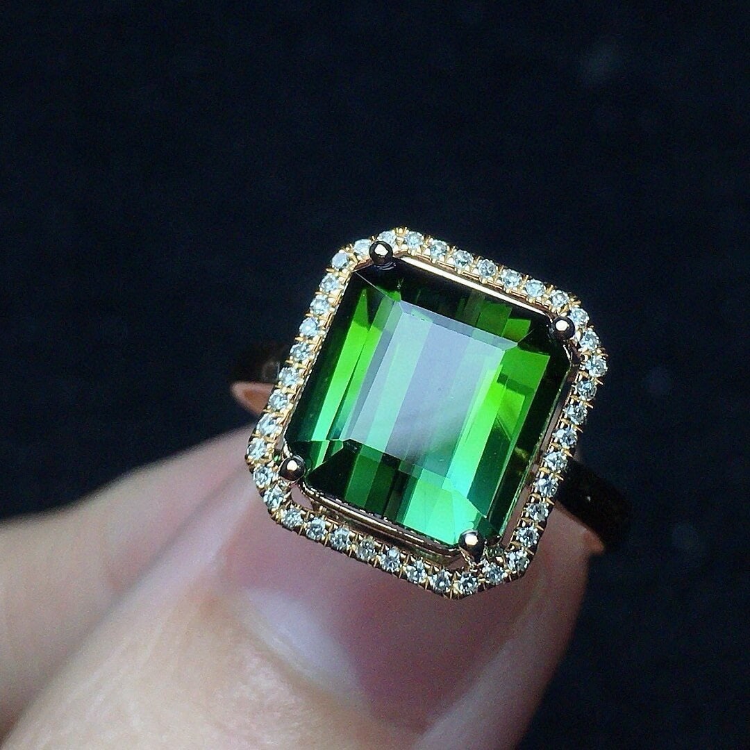 14k Gold 4.13 Ct Natural Tourmaline & Diamond Ring: Ref:230940056 // gold content:14k gold // ring size:7. 25us // // main gemstone:tourmaline // shape:octagonal // carat weight:4. 13ct // color:green // treatment:natural // // adjacent gemstone 2