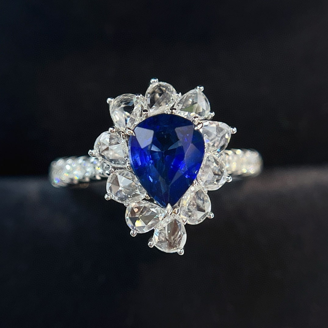 14k Gold 2.34 Ctw Vivid Blue Natural Sapphire & Diamond Ring: Ref:230940093 // gold content:14k gold // ring size:7. 25us // // main gemstone:sapphire // shape:pear // carat weight:1. 45ct // color:vivid blue // treatment:natural // // adjacent gemstone 2 :