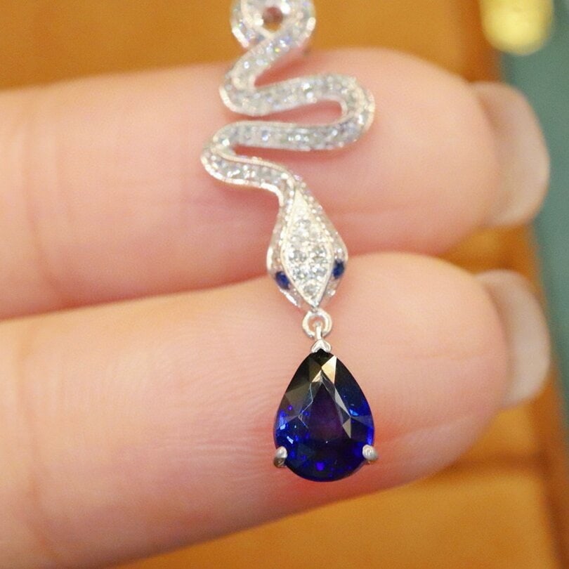 14k Gold 1.35 Ctw Natural Sapphire & Diamond Pendant( Without Chain ): Ref:230940131 // gold content:14k gold // main gemstone:sapphire // shape:pear // carat weight:1. 07ct // color:royal blue // treatment:natural // // adjacent gemstone 2 : diamond // number of